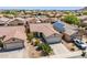 Charming single-story home with desert landscaping and solar panels on an adjacent structure at 645 W Kingman Loop, Casa Grande, AZ 85122