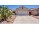 Charming single-story home featuring a two-car garage and desert landscaping at 645 W Kingman Loop, Casa Grande, AZ 85122