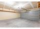 The garage features an automatic door opener, shelving, and concrete flooring at 645 W Kingman Loop, Casa Grande, AZ 85122