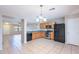 Spacious kitchen features tile flooring, stainless steel appliances, and a breakfast nook at 645 W Kingman Loop, Casa Grande, AZ 85122