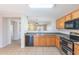 Traditional kitchen features oak cabinets, granite countertops and stainless steel appliances at 645 W Kingman Loop, Casa Grande, AZ 85122