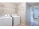 This laundry room features shelving, washer, and dryer hookups at 645 W Kingman Loop, Casa Grande, AZ 85122