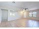 Spacious living room with ceramic tile floors and a ceiling fan at 645 W Kingman Loop, Casa Grande, AZ 85122