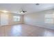 Open living space with ceramic tile, a ceiling fan, and neutral walls at 645 W Kingman Loop, Casa Grande, AZ 85122