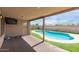 Beautiful outdoor space with pool, artificial turf and covered patio at 681 W Racine Loop, Casa Grande, AZ 85122