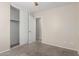 Bedroom featuring sliding door closet, neutral walls, and plush carpeting at 681 W Racine Loop, Casa Grande, AZ 85122