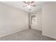 Cozy bedroom featuring neutral walls, carpet, and a ceiling fan at 681 W Racine Loop, Casa Grande, AZ 85122