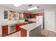 A warm kitchen featuring granite countertops, stainless steel appliances, and plenty of cabinet storage at 681 W Racine Loop, Casa Grande, AZ 85122