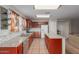 A warm kitchen featuring granite countertops, stainless steel appliances, and plenty of cabinet storage at 681 W Racine Loop, Casa Grande, AZ 85122