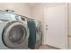 Modern laundry room with side-by-side washer and dryer units at 681 W Racine Loop, Casa Grande, AZ 85122