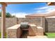 Outdoor kitchen featuring built-in BBQ, countertop, and storage at 681 W Racine Loop, Casa Grande, AZ 85122