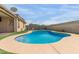 Backyard pool offers a private oasis with artificial turf and a spacious patio area at 681 W Racine Loop, Casa Grande, AZ 85122