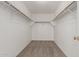 Walk-in closet with carpet, white walls, and metal bars for hanging clothes at 681 W Racine Loop, Casa Grande, AZ 85122