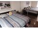 Calm bedroom with natural light, a modern bed, and stylish decor at 7118 S 37Th Gln, Phoenix, AZ 85041