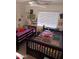Inviting bedroom with two twin beds, a ceiling fan, and a bright, airy atmosphere at 7118 S 37Th Gln, Phoenix, AZ 85041