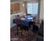 Cozy dining area featuring a chandelier and seating for four at 7118 S 37Th Gln, Phoenix, AZ 85041