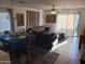 Open concept living room and dining area with tile flooring and neutral tones at 7118 S 37Th Gln, Phoenix, AZ 85041
