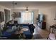 Open concept living room and dining area with tile flooring and neutral tones at 7118 S 37Th Gln, Phoenix, AZ 85041