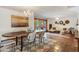 Dining area boasting a chandelier, Saltillo floors, and French door access to the yard at 7526 E Edgemont Ave, Scottsdale, AZ 85251