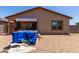 Backyard featuring a patio, gravel landscaping, and mature trees at 8012 S Magic Dr, Casa Grande, AZ 85193