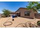 Backyard featuring a patio, gravel landscaping, and mature trees at 8012 S Magic Dr, Casa Grande, AZ 85193