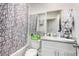 Functional bathroom with white vanity and cabinet, shower and tub combo at 8012 S Magic Dr, Casa Grande, AZ 85193