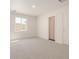 Bright bedroom with plush carpet, large window, and plenty of natural light at 8012 S Magic Dr, Casa Grande, AZ 85193