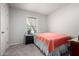 Cozy bedroom featuring neutral walls, carpet, and a large window at 8012 S Magic Dr, Casa Grande, AZ 85193