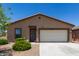 Charming single-story home featuring a two-car garage and low maintenance desert landscaping in the front yard at 8012 S Magic Dr, Casa Grande, AZ 85193