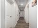 Hallway with wood floors and white doors at 8012 S Magic Dr, Casa Grande, AZ 85193