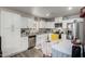 Well-lit kitchen with modern appliances, white cabinets, and granite countertops at 8012 S Magic Dr, Casa Grande, AZ 85193
