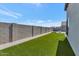A well-maintained backyard featuring artificial turf, with a view of mountains in the distance at 812 E Summerside Rd, Phoenix, AZ 85042