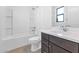 Bright bathroom featuring a bathtub, shower, toilet, and vanity with modern fixtures at 812 E Summerside Rd, Phoenix, AZ 85042