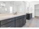Bright bathroom with double vanity sinks, a large mirror, and white subway tile in the shower at 812 E Summerside Rd, Phoenix, AZ 85042