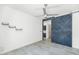 Bedroom featuring a rustic sliding barn door and tile flooring at 812 E Summerside Rd, Phoenix, AZ 85042