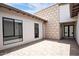 Spacious courtyard featuring a neutral color scheme and stone block accent wall at 812 E Summerside Rd, Phoenix, AZ 85042