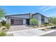 Beautiful single-story home featuring a modern design, desert landscaping, and a two-car garage at 812 E Summerside Rd, Phoenix, AZ 85042