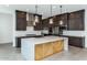 The kitchen features a large center island with modern pendant lighting at 812 E Summerside Rd, Phoenix, AZ 85042
