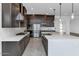 Well-equipped kitchen boasts stainless appliances, a center island, and ample cabinet space at 812 E Summerside Rd, Phoenix, AZ 85042