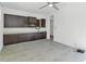 Spacious kitchen with dark wood cabinets, tile flooring, and plenty of counter space for cooking at 812 E Summerside Rd, Phoenix, AZ 85042