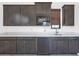 Kitchen area featuring custom cabinets, modern appliances, a stylish microwave, and plenty of countertop space at 812 E Summerside Rd, Phoenix, AZ 85042