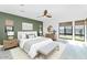 Relaxing bedroom featuring a serene color scheme, large windows, and modern furnishings at 812 E Summerside Rd, Phoenix, AZ 85042