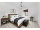 Cozy main bedroom with neutral tones, ceiling fan, and comfortable furnishings at 812 E Summerside Rd, Phoenix, AZ 85042