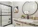 Well-lit bathroom featuring a marble countertop, vanity, toilet, and shower with glass door at 8787 E Mountain View Rd # 2100, Scottsdale, AZ 85258