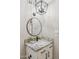 Bathroom with stylish lighting, round mirror, granite countertop, and white cabinetry at 8787 E Mountain View Rd # 2100, Scottsdale, AZ 85258