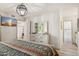 Comfortable bedroom with an open doorway and ensuite bathroom at 8787 E Mountain View Rd # 2100, Scottsdale, AZ 85258