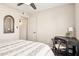 Inviting bedroom featuring a desk area, wood-look flooring, and bright neutral decor at 8787 E Mountain View Rd # 2100, Scottsdale, AZ 85258