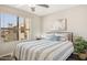 Bright bedroom with a comfortable bed, large window, and modern decor at 8787 E Mountain View Rd # 2100, Scottsdale, AZ 85258