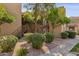 Apartment exterior with well-maintained landscaping and staircases leading to the upper levels at 8787 E Mountain View Rd # 2100, Scottsdale, AZ 85258