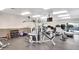 Well-equipped gym with weight machines, free weights, and mounted television at 8787 E Mountain View Rd # 2100, Scottsdale, AZ 85258
